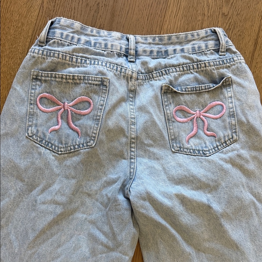Light Blue High-Rise Flare Jeans with Pink Bow Pocket Embroidery